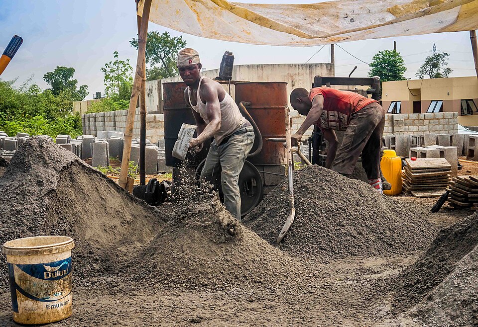 Construction workers mixing cement: Africa Construction