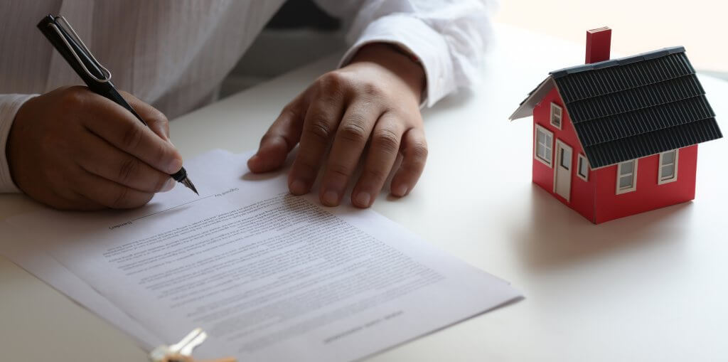 New house handing over documents being signed by the client 