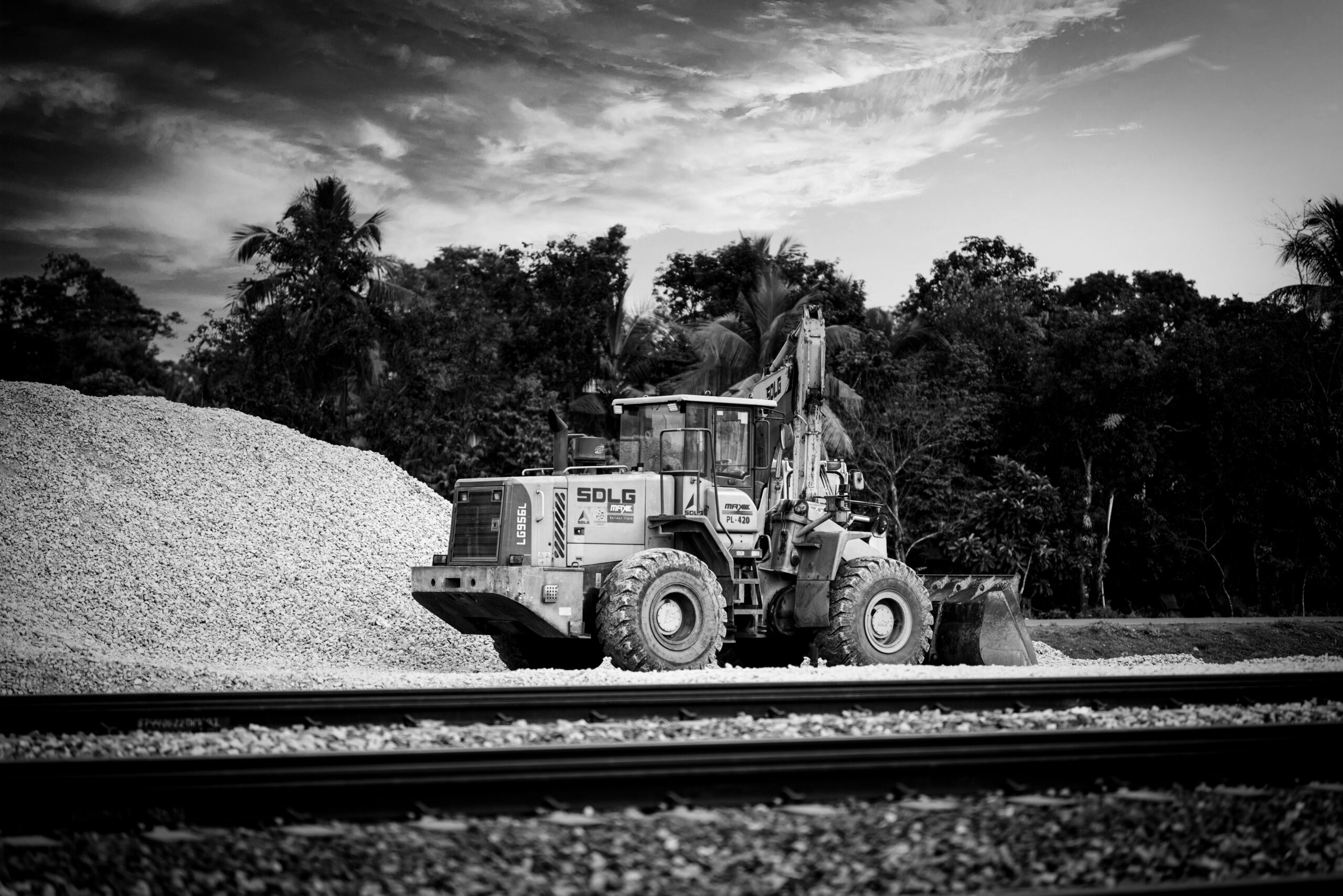 Monochrome photograph of an industrial loader at a construction site.