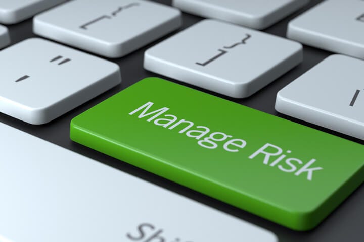 A manage risk computer keyboard button. 