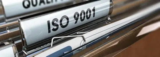 ISO 9001 labelled file in an office cabinet. 