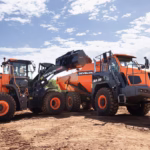 Develon-Hyundai Merger: Two large construction vehicles working together
