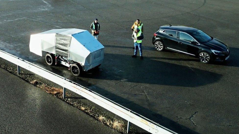 The AI pothole repair robot doing a road repair demonstration. trial test.