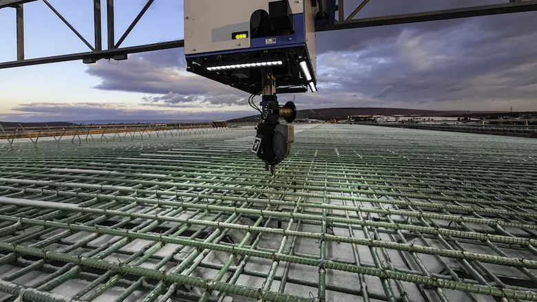 Tybot, a rebar-tying robot, in operation.