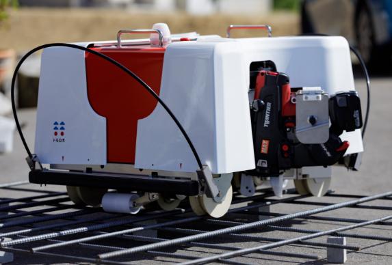 A Tomorobo rebar-tying robot in operation.