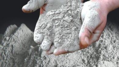 Africa's Cement Market. A person holding cement in their hands.