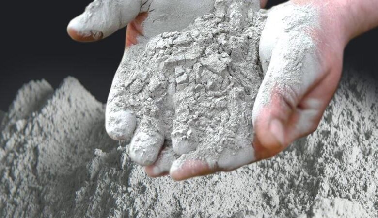 Africa's Cement Market. A person holding cement in their hands.